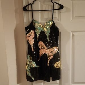 NWT sequin mini dress with adjustable straps and a side split.